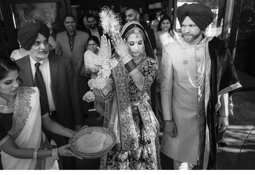 Sikh wedding ceremony, rice thrown into the air by bride